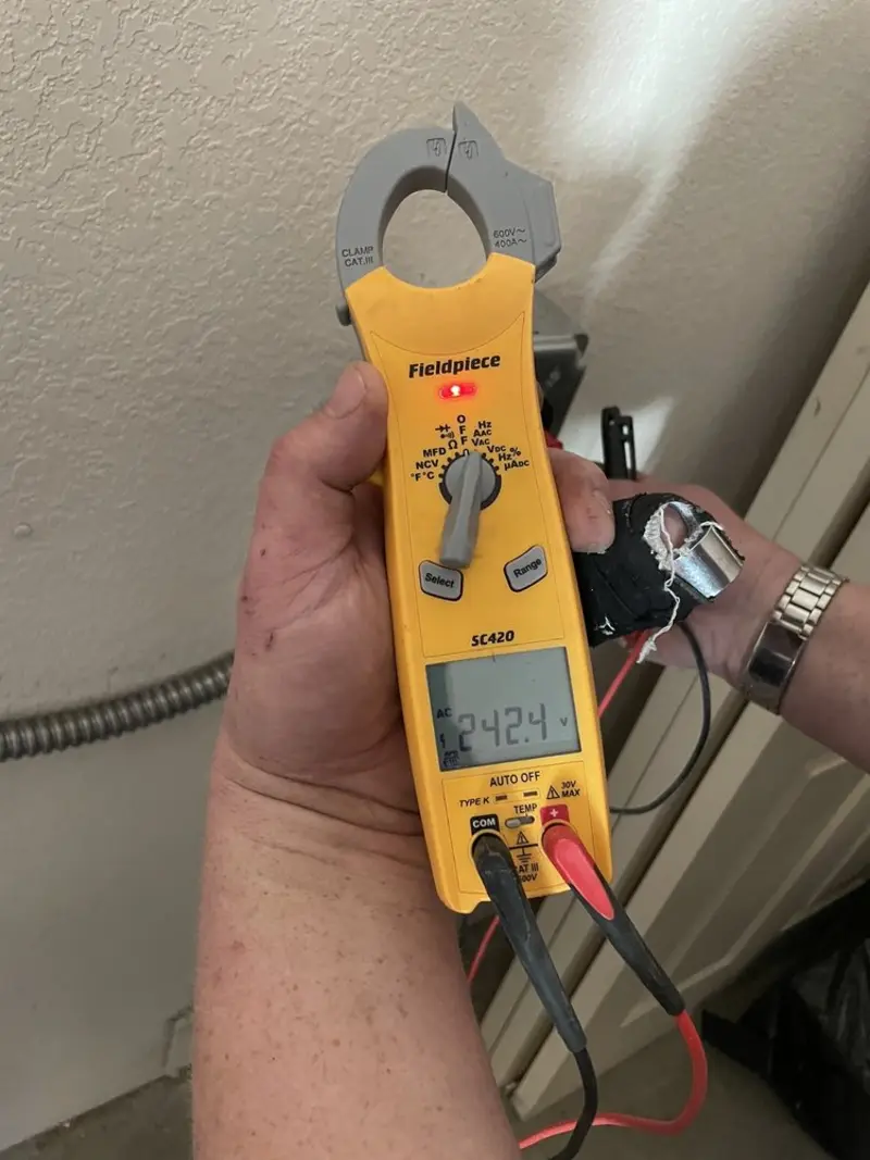 Voltage testing with clamp meter during Ceiling Fan Installation in Alton